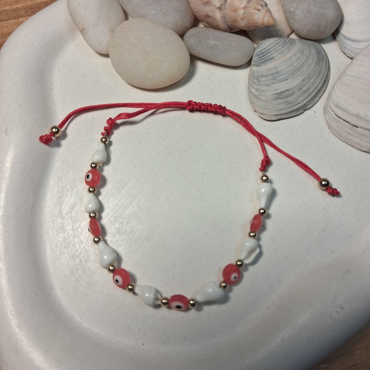 TB003 | Tobillera ajustable ojitos protectores y caracoles