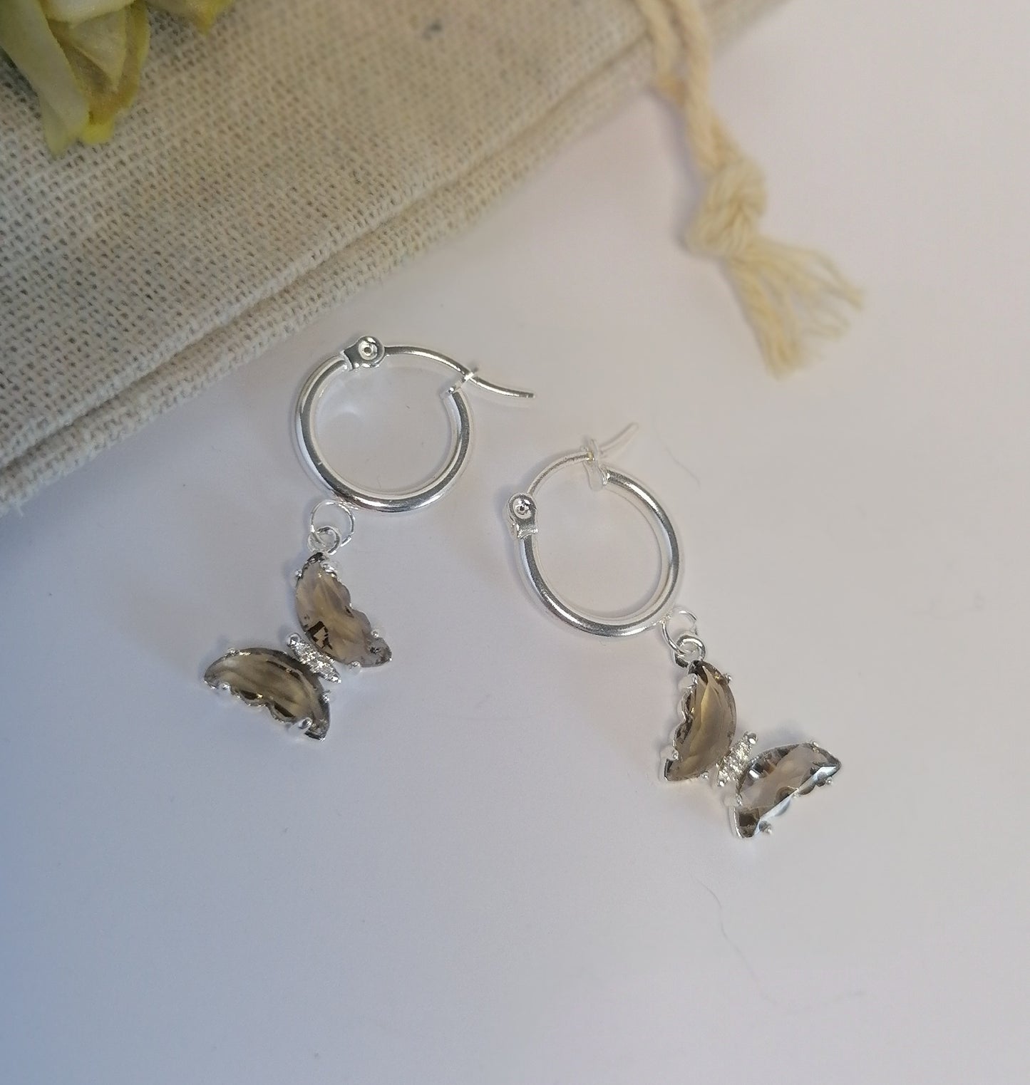 AQ032 | Aros mariposa en acero blanco