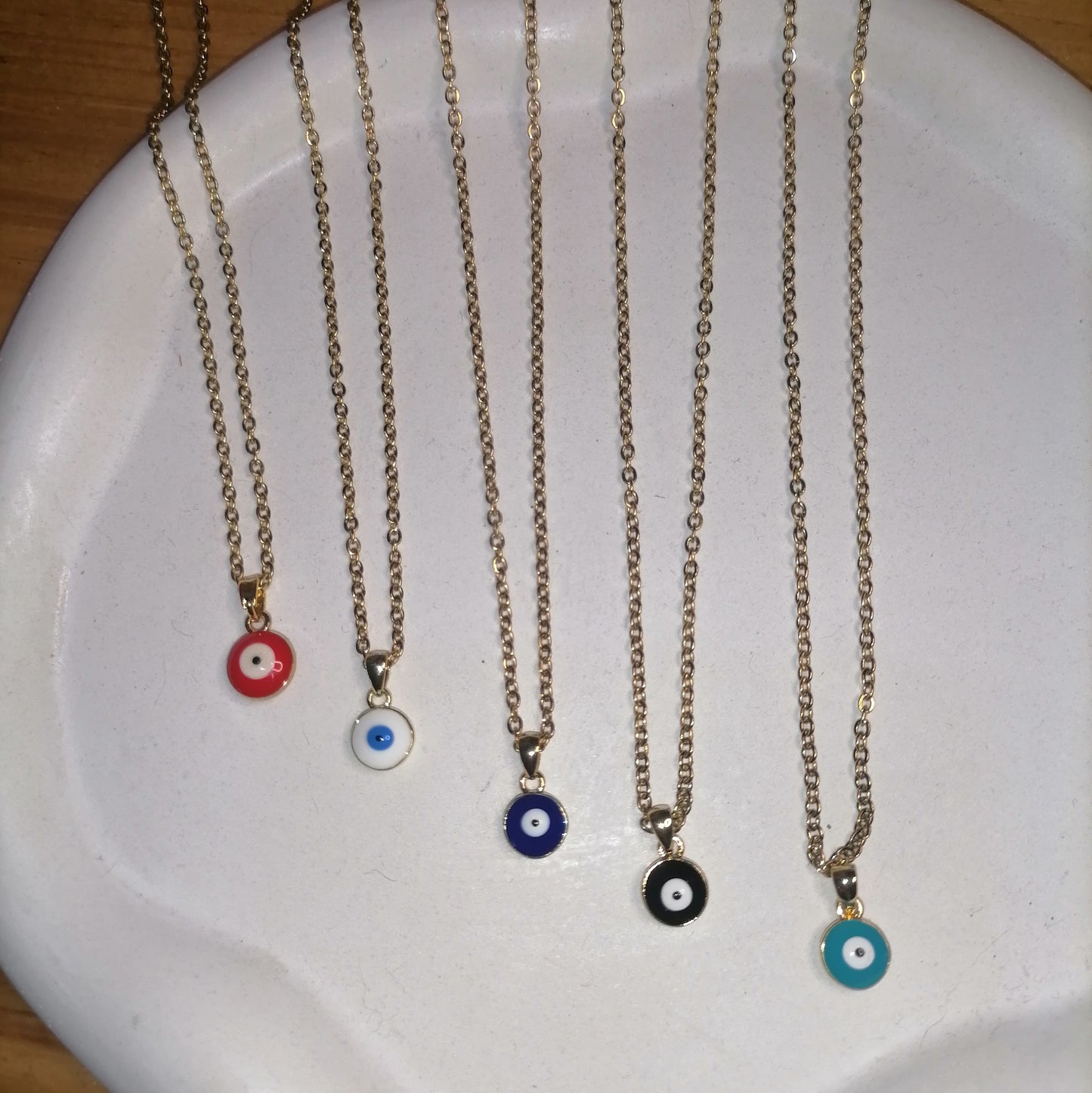 CD027 | Cadena en acero dorado y dije ojo protector