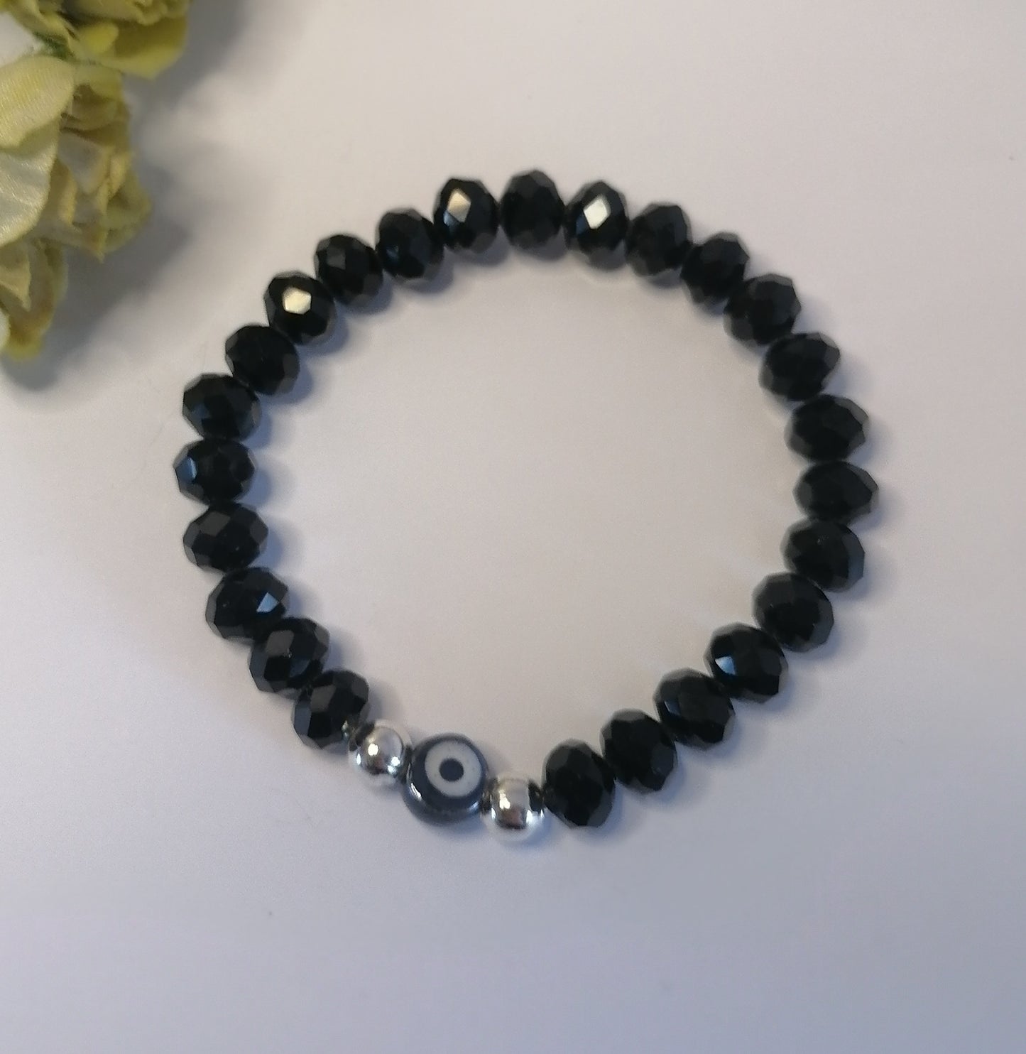 PQ013 | Pulsera cuentas negro brillante con dije ojo turco en acero blanco