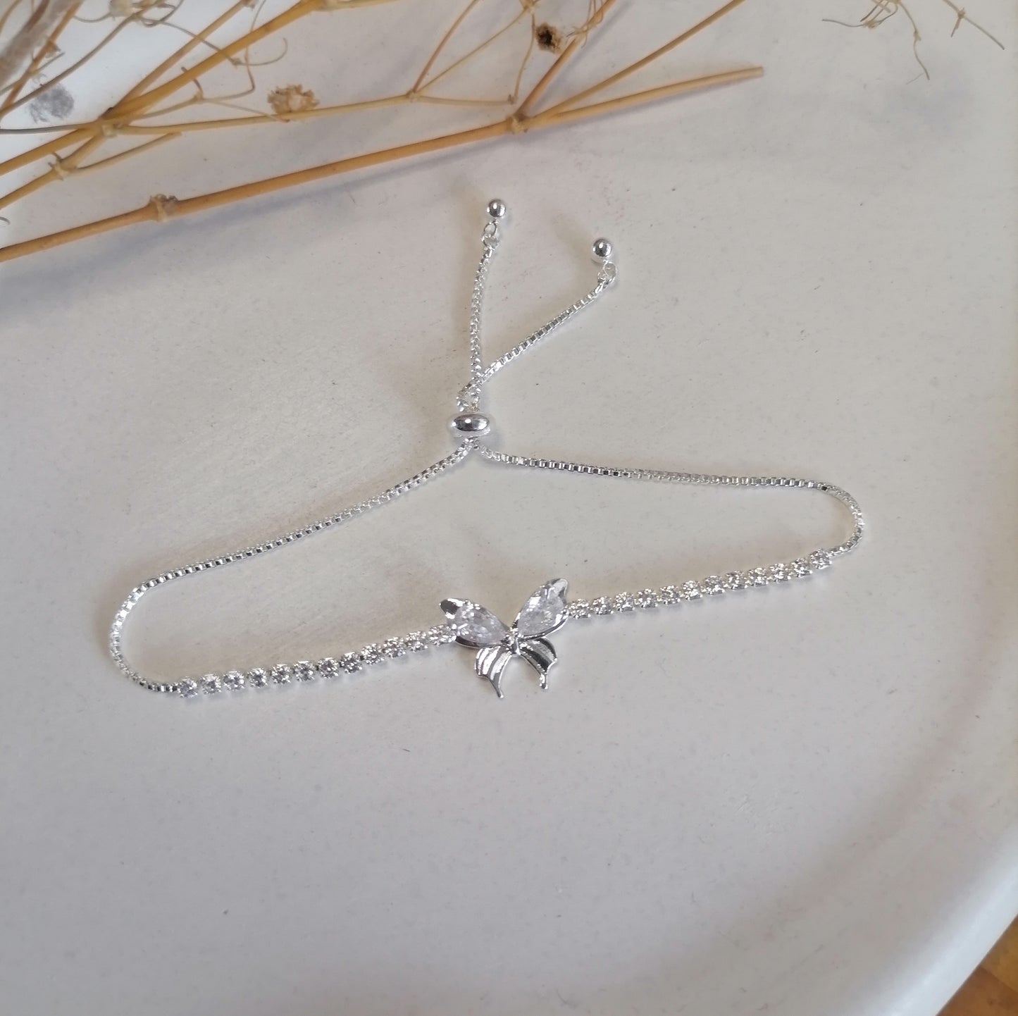 PQ038 | Pulsera ajustable en acero blanco mariposa y circonias