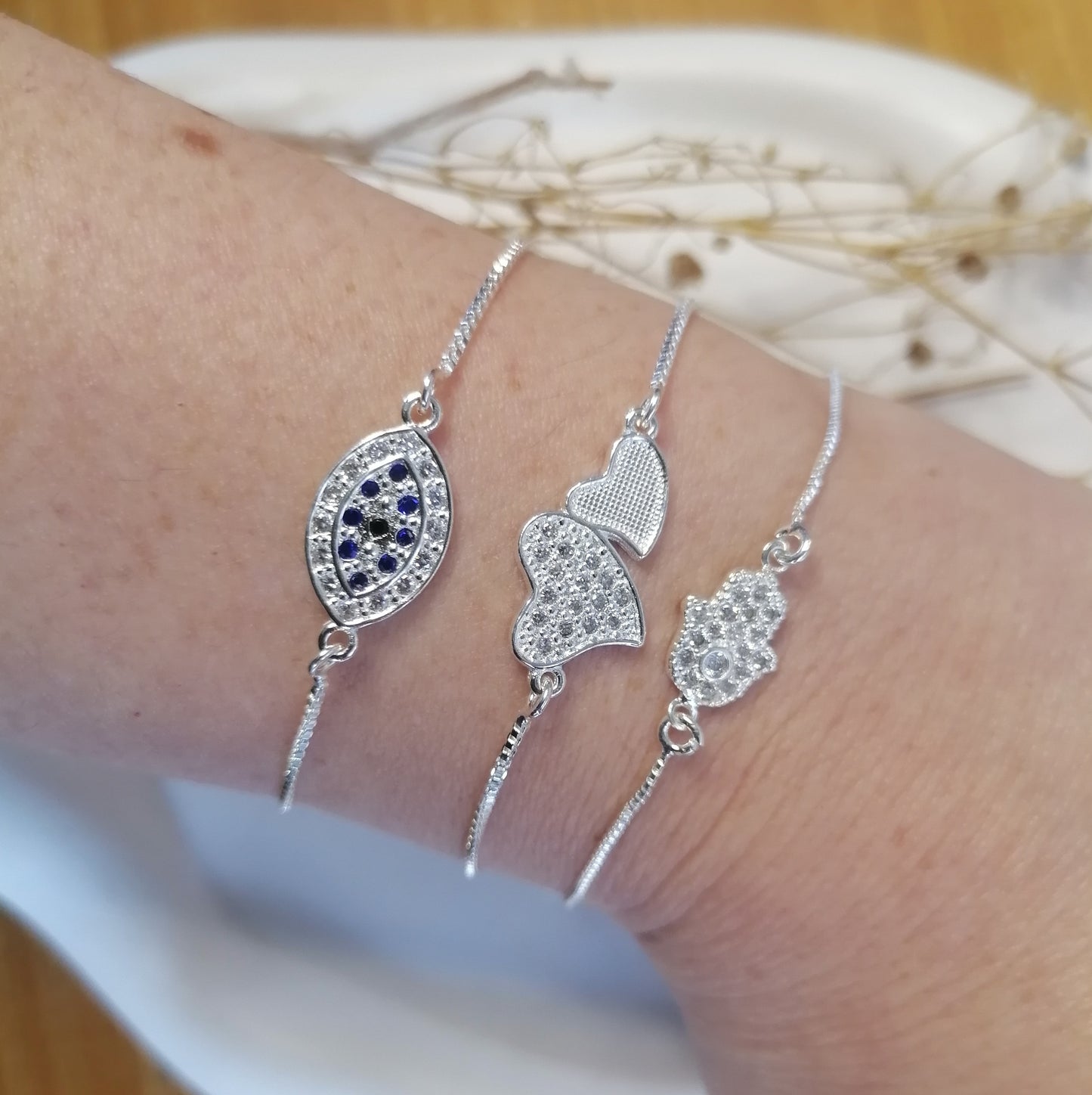 PQ042 | Pulsera ajustable en acero blanco dos corazones y circonias