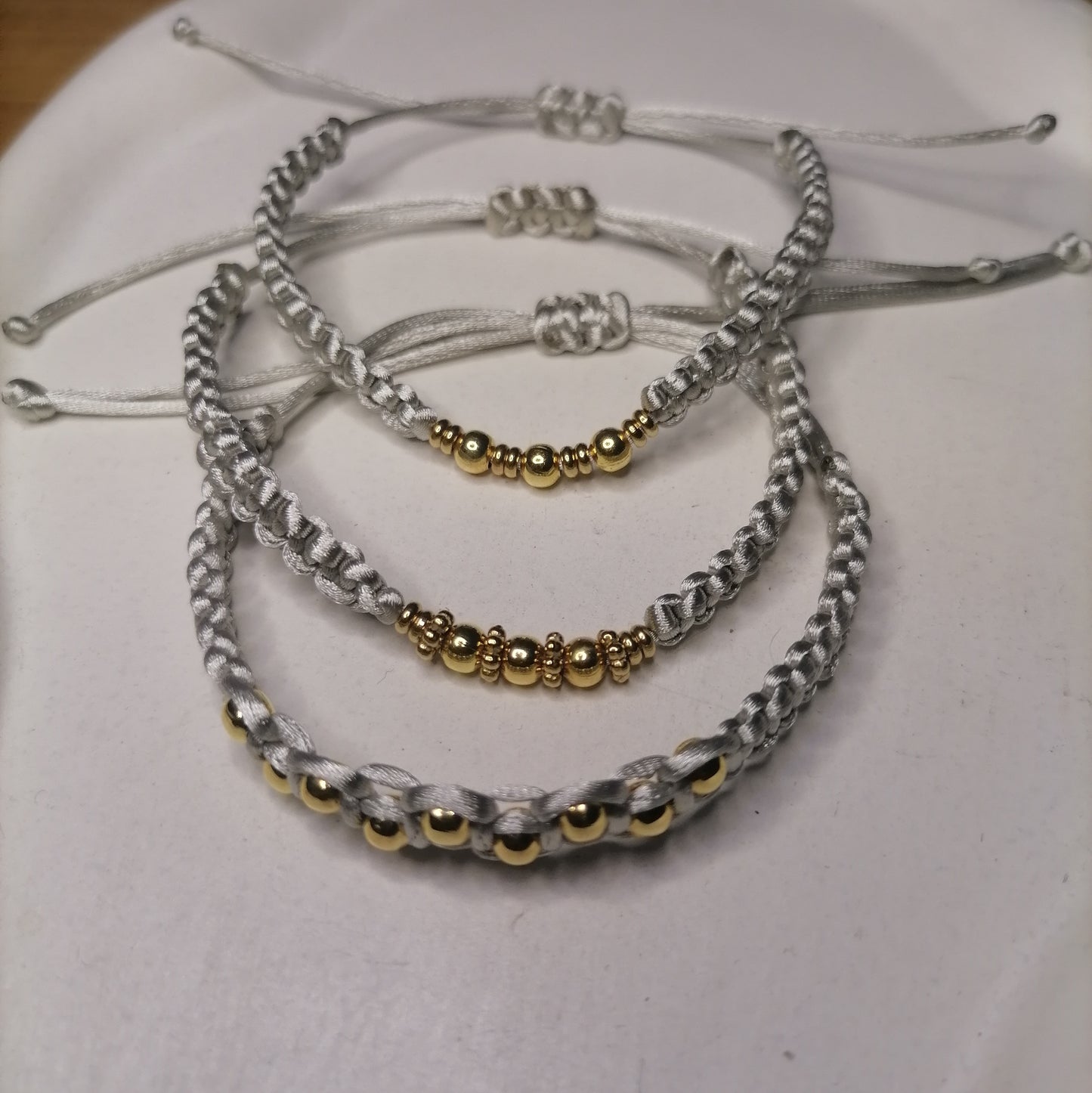 PT005 | Pulsera tejida regulable con separadores en acero dorado