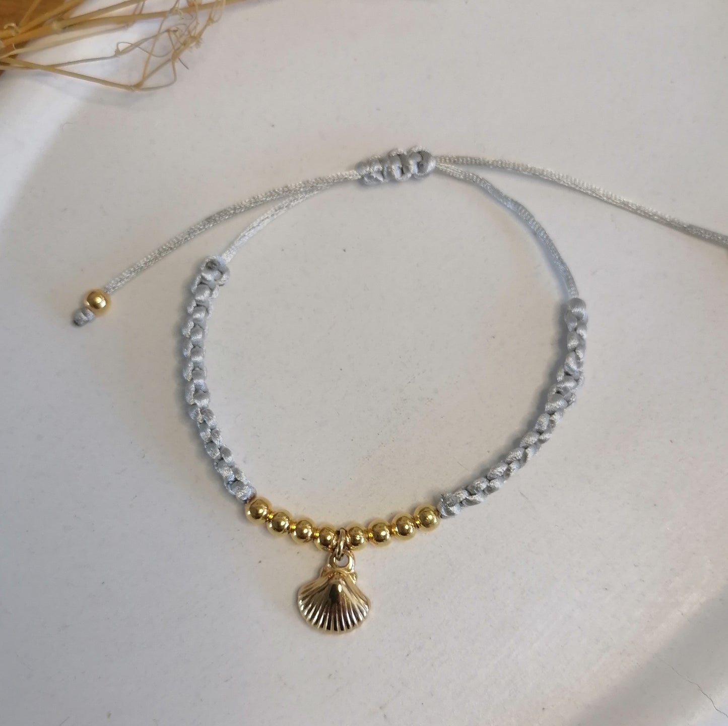 PT005 | Pulsera tejida regulable con separadores en acero dorado
