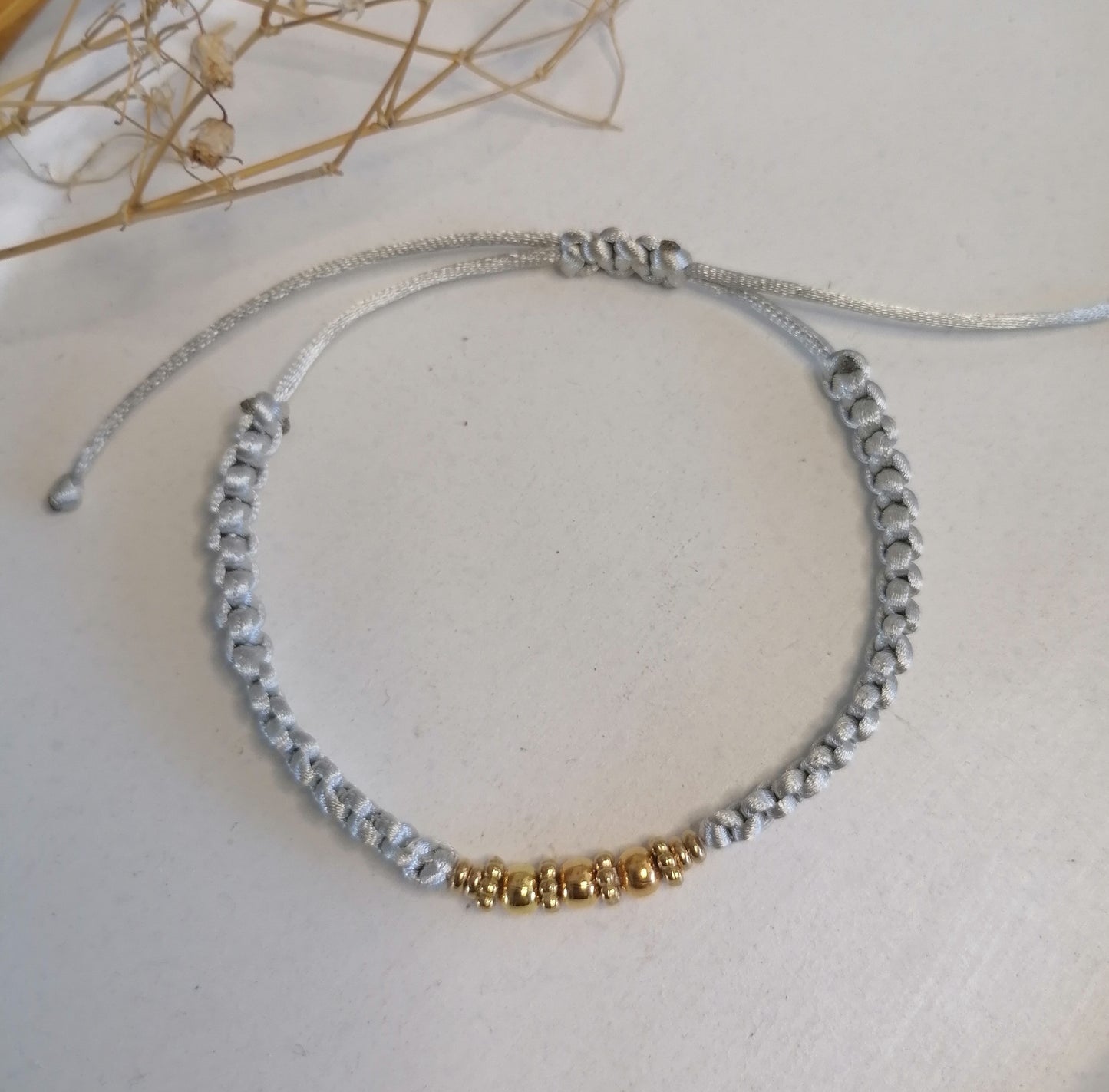 PT005 | Pulsera tejida regulable con separadores en acero dorado