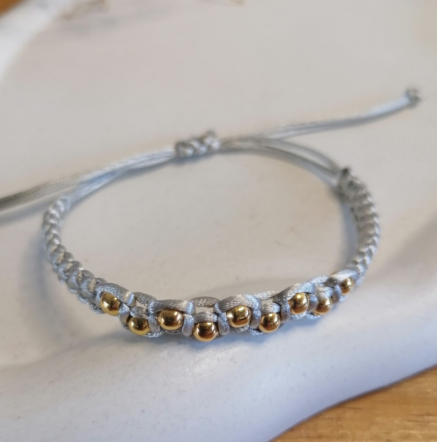 PT005 | Pulsera tejida regulable con separadores en acero dorado