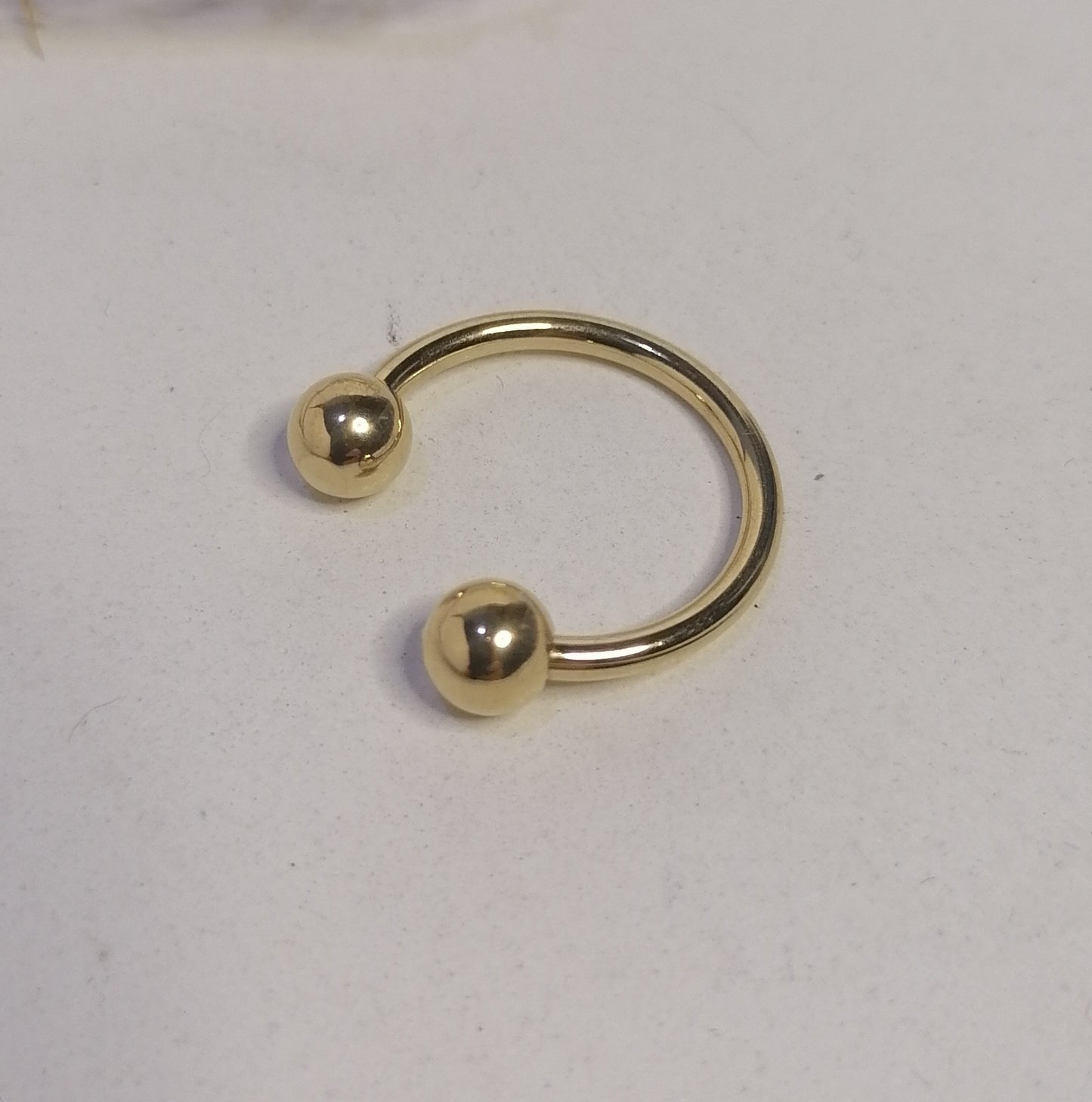 RD005 | Anillo abierto en acero dorado esferas