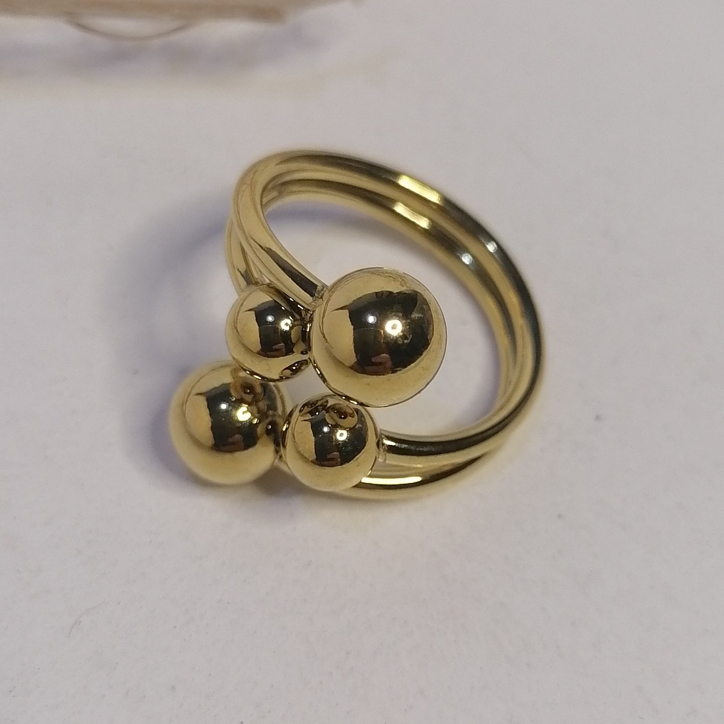 RD005 | Anillo abierto en acero dorado esferas