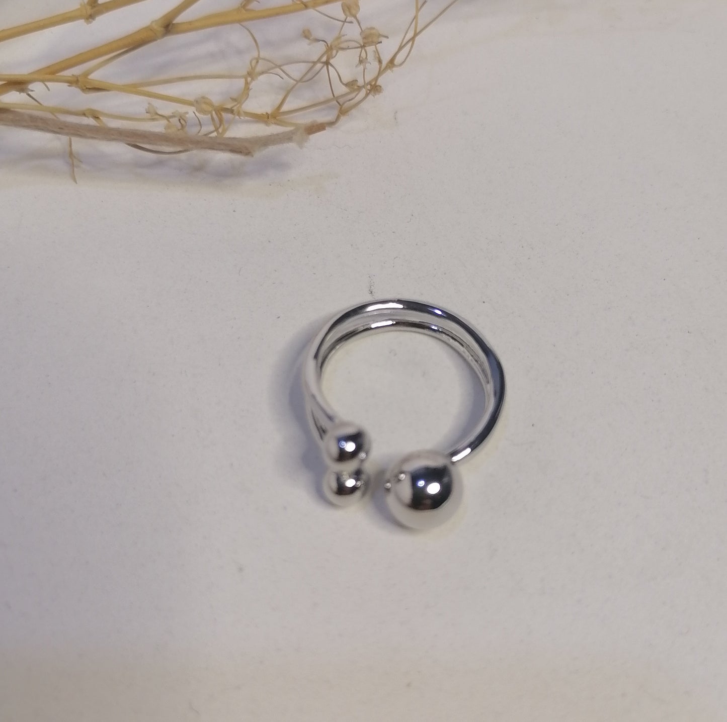 RQ018 | Anillo abierto en acero inoxidable tres esferas