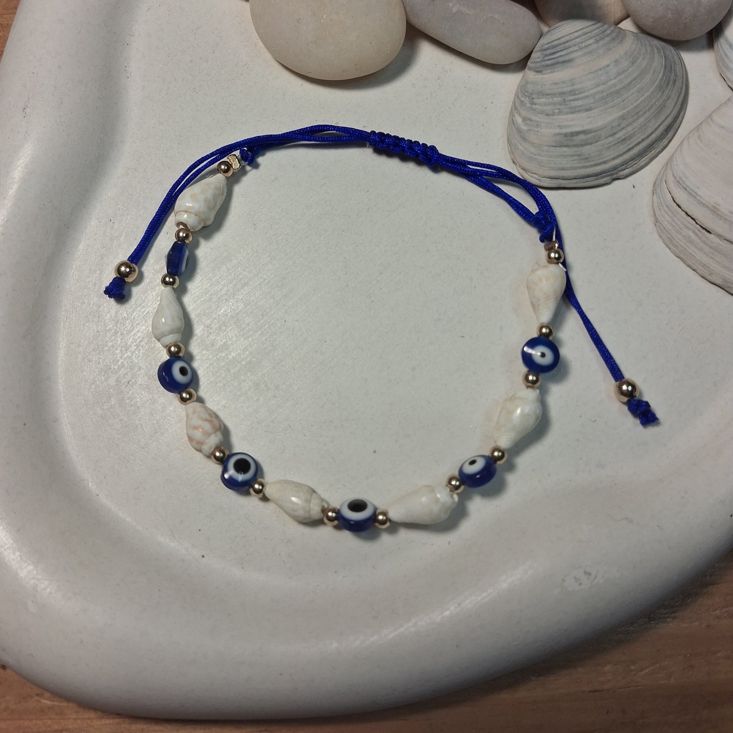 TB003 | Tobillera ajustable ojitos protectores y caracoles