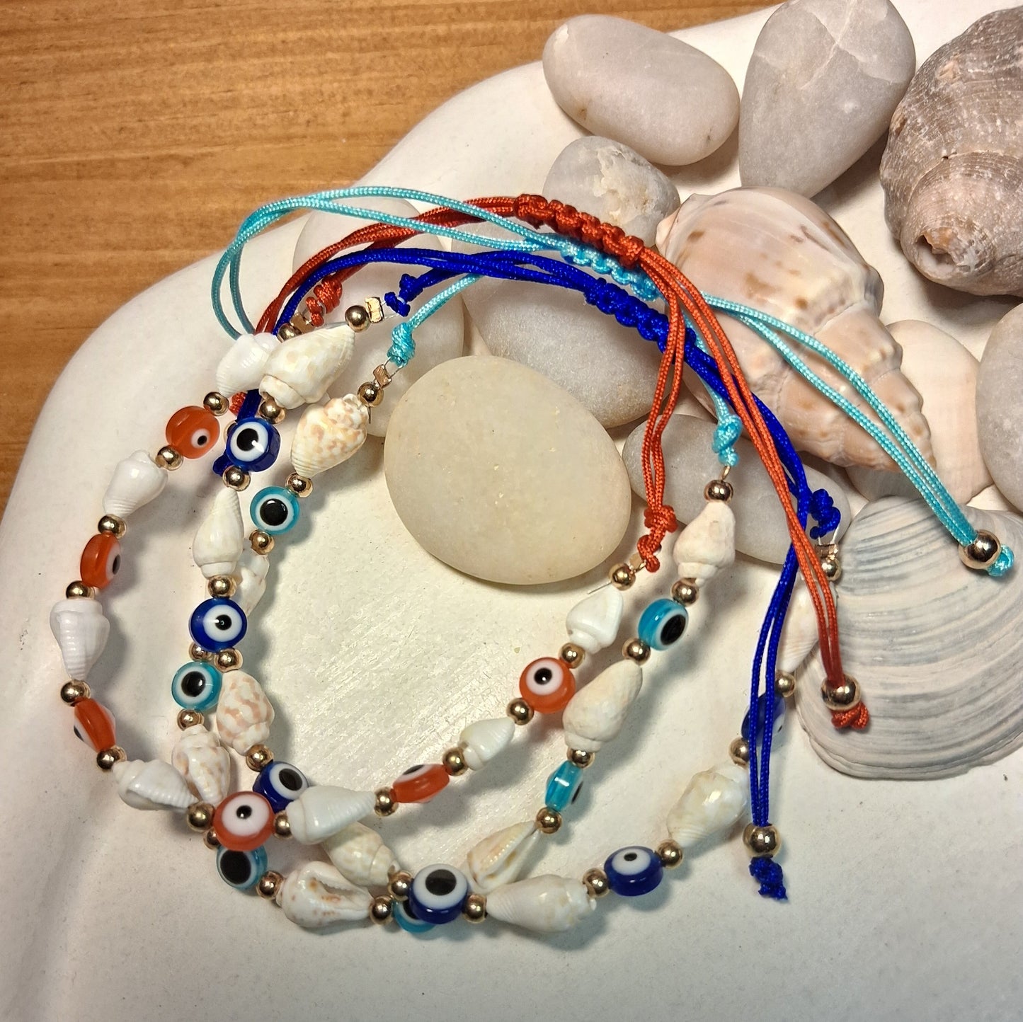 TB003 | Tobillera ajustable ojitos protectores y caracoles