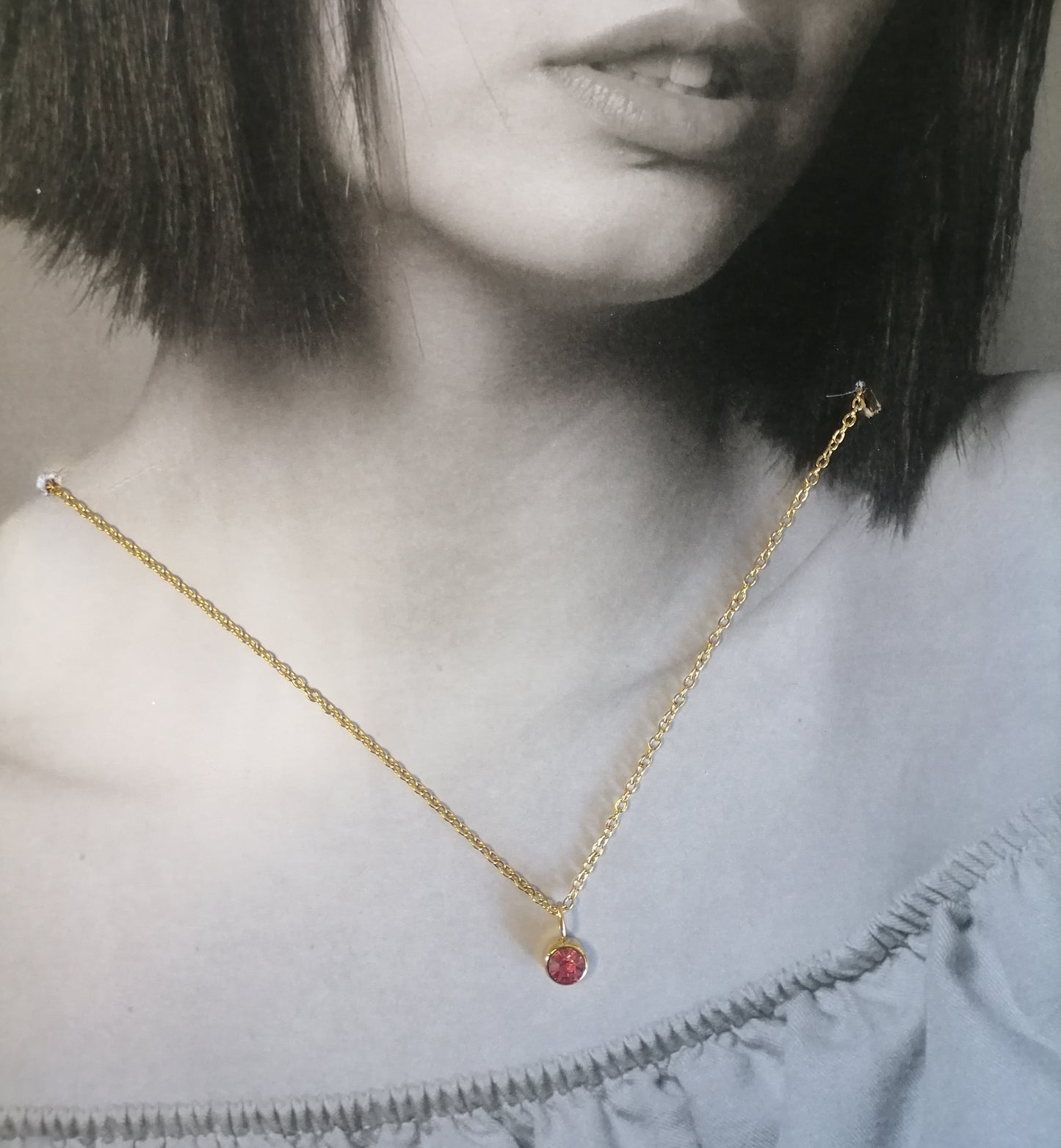 CD009 | Collar punto de luz en acero dorado