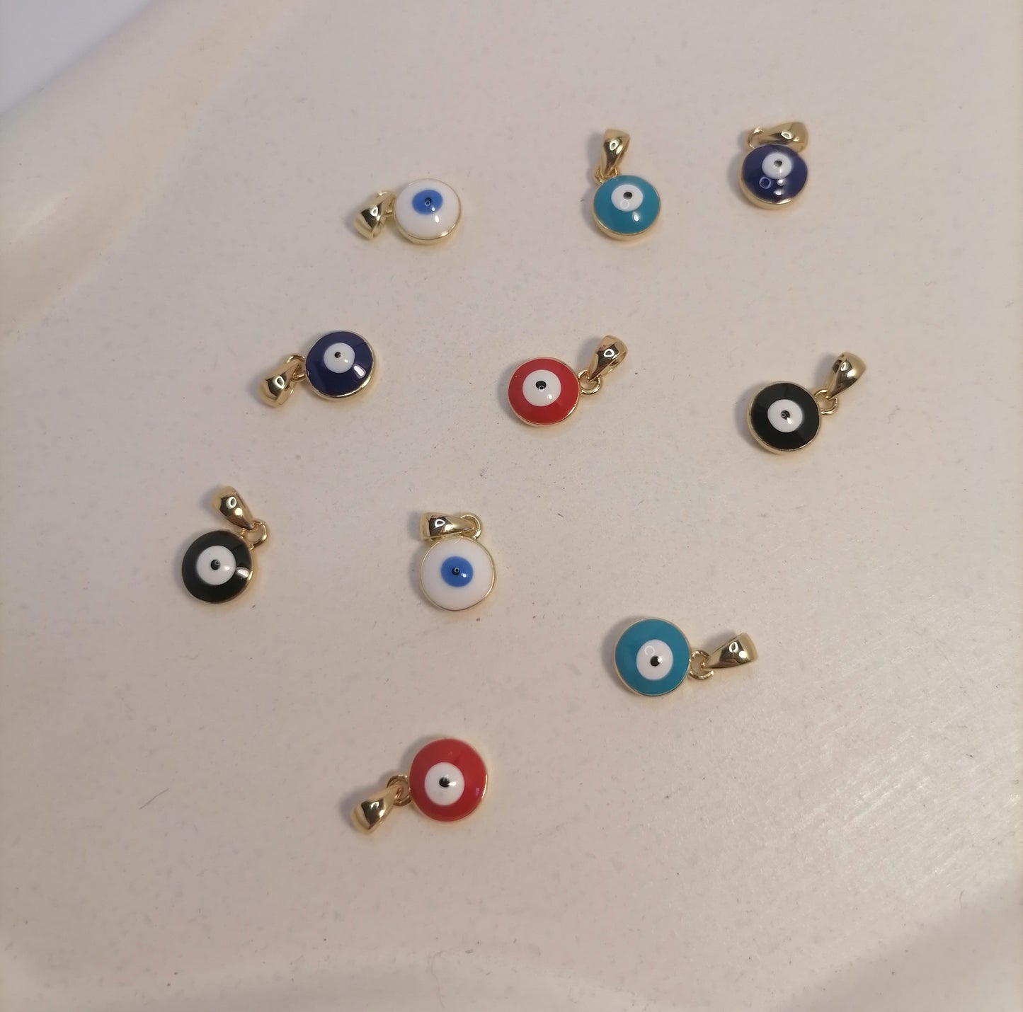 CD019 | Cadena en acero dorado con cierre marinero con dos dijes