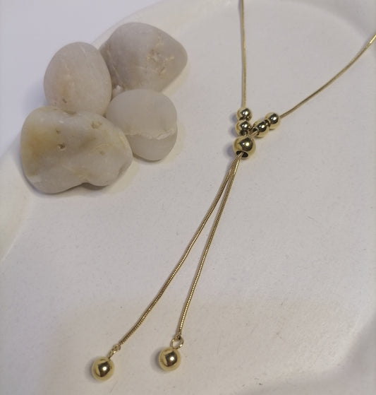 CD031 | Colgante regulable con esferas macizas en acero dorado