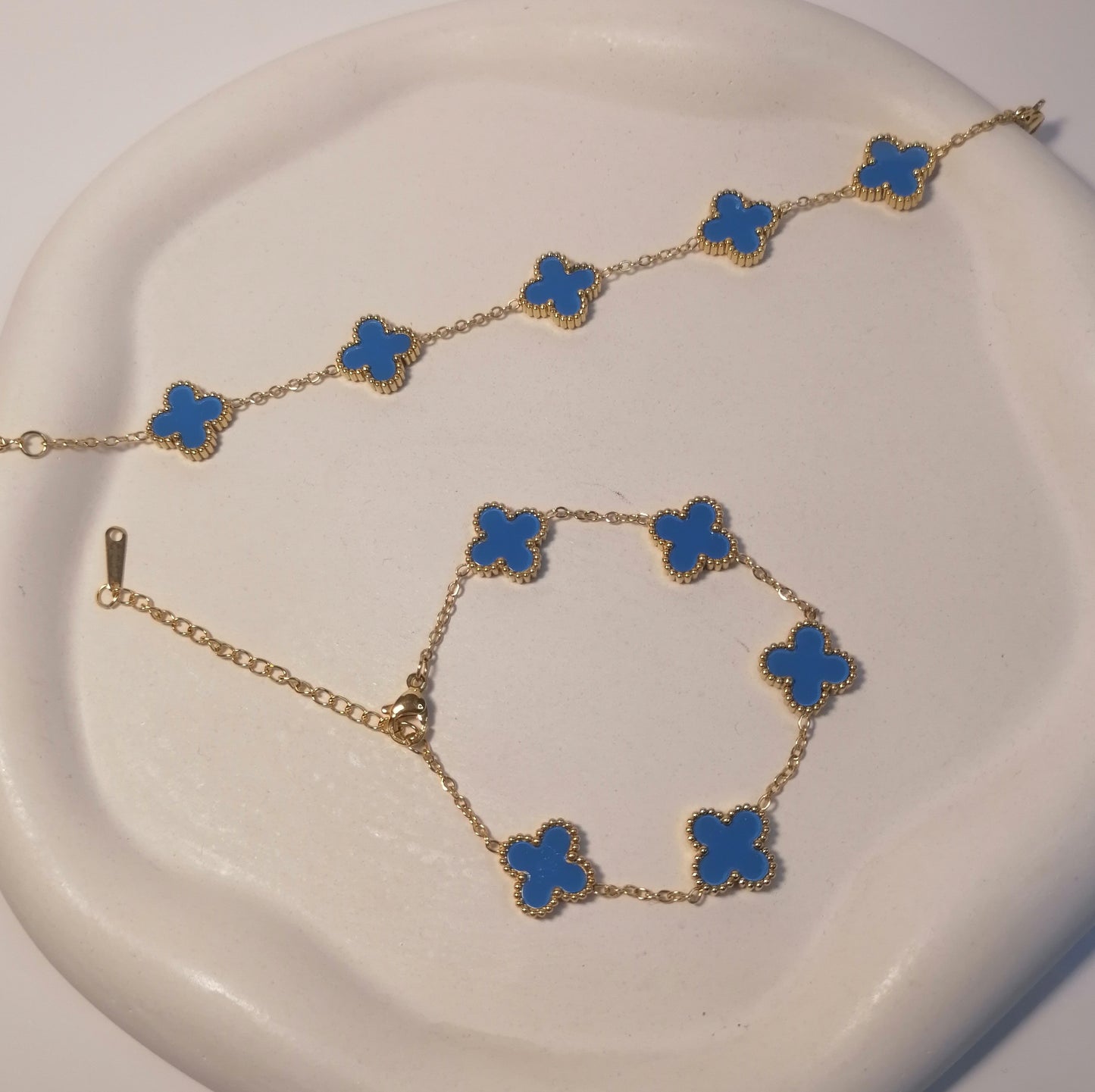 PD014 | Pulsera acero dorado tréboles de cuatro hojas esmaltado celeste