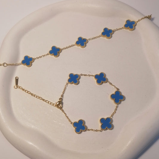 PD014 | Pulsera acero dorado tréboles de cuatro hojas esmaltado celeste