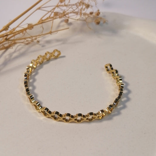 PD026 | Esclava en acero dorado tréboles calados