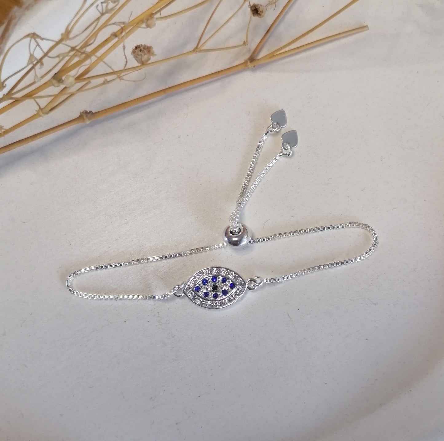 PQ044 | Pulsera ajustable en acero blanco ojo protector y circonias