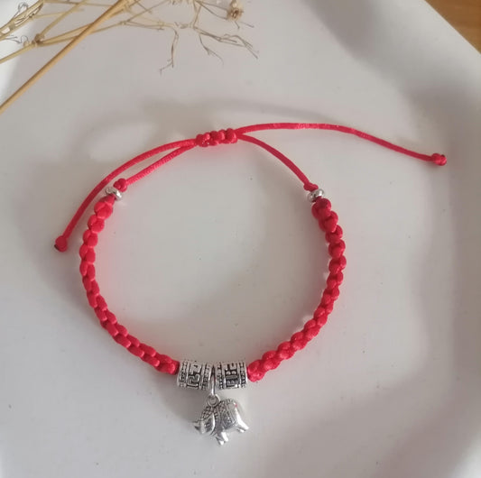 PT008 | Pulsera tejida regulable con dije metálico