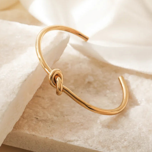 PD023 | Esclava en acero dorado nudo